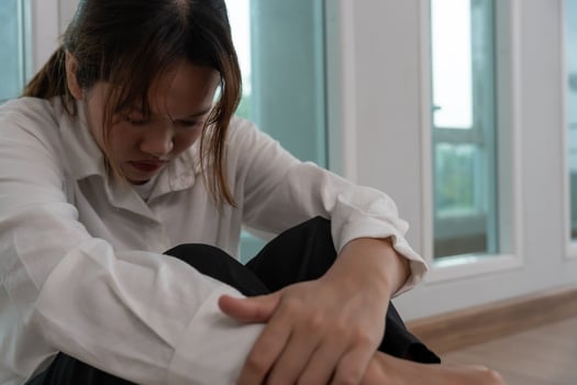 Depression and mental illness. Asian woman disappointed, sad after receiving bad news. Stressed girl confused with unhappy problems, arguing with boyfriend, cry and worry about unexpected pregnant photo