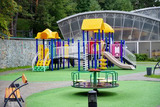 Colorful children's playground in a green park. Play childhood. photo