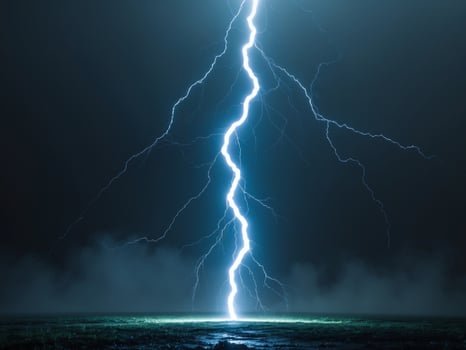 A Powerful Lightning Strike Illuminates a Dark, Misty Field at Night, Natures Fury. photo