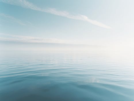 A calm ocean with a sky in the background photo