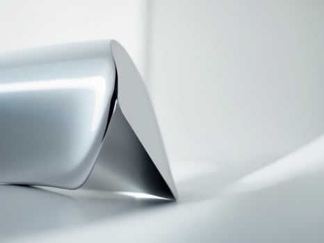 Abstract Silver Chrome Object on White Surface, Minimalist Aesthetic, Studio Shot. photo