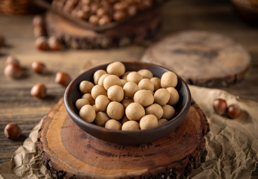Roasted hazelnuts covered with white chocolate photo