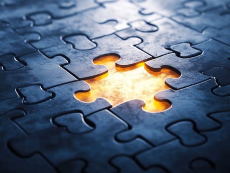 Puzzle piece missing from dark, illuminated background photo