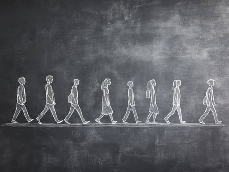 Figures walking in a line on a chalkboard background photo