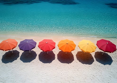 sun umbrellas casting shadows on sandy beach, photo