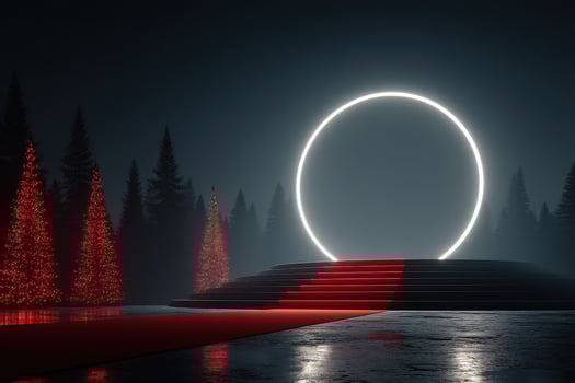Elegant circular light installation at night surrounded by red illuminated trees in a mystical forest setting photo