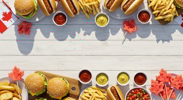 Festive Canada Day Celebration with Delicious Food and Refreshing Treats on White Surface photo