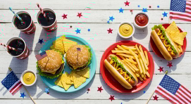 Patriotic picnic feast celebrating american spirit with burgers, fries and flags photo
