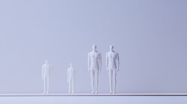 Distinct mannequins on a simple backdrop photo
