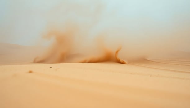 dust storm in the middle of a desert photo
