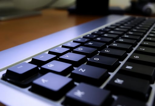 close up of a keyboard on a desk photo