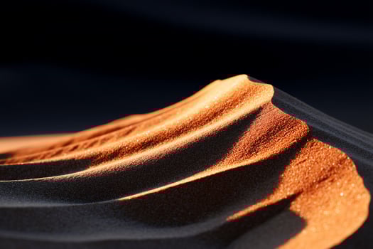 Close-up desert dune, sunlit ripples photo