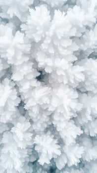 Close up of white ice crystals formed in winter. Tiny delicate snow formations with a light blue background. Frosty shapes create a textured surface. photo