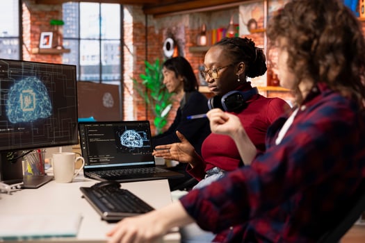 Teamworking startup technicians cooperating to do rapid technological advancement in AI industry. Silicon Valley company colleagues leveraging deep learning tech in workspace to gain competitive edge photo