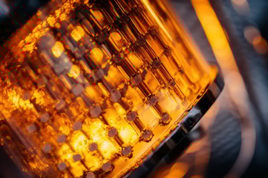 Close up of lit glass tube structure photo
