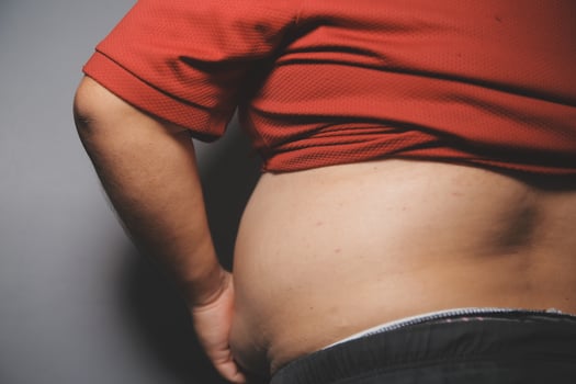 A man with a large belly and a red shirt photo