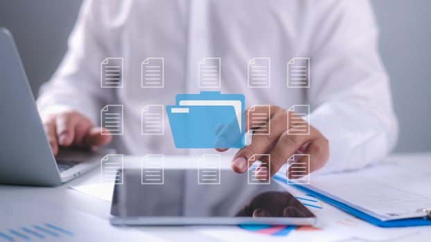 Businessman using laptop with holographic interface to access files, Showcasing cloud computing, digital file management, Data organization, and online document security technology. photo