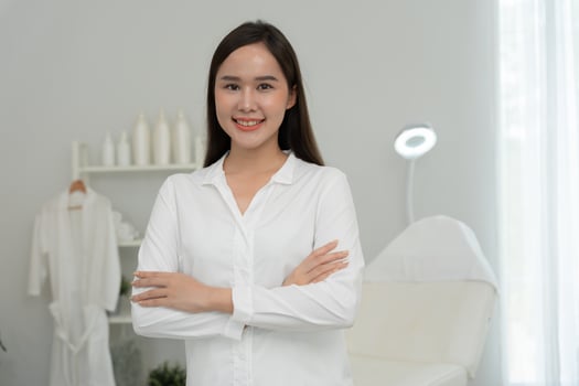 Beauty clinic Portrait specialist beauty woman for VIP customer, white room with a bed and a chair. room is clean and well organized, health care, dermatology, style, wellness, cosmetology, beautician photo