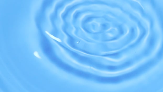 Tranquil Blue Water Ripple Creating Soothing Patterns in a Serene Minimalist Setting photo