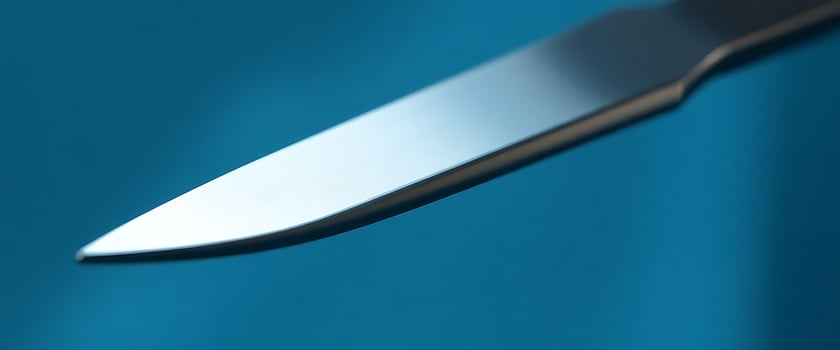 close up of a knife on a blue background photo