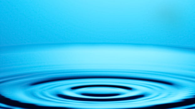Water ripple background with blue sky photo