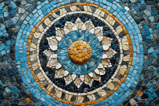 Circular mosaic depicting a stylized sun or flower with blue and gold tiles photo