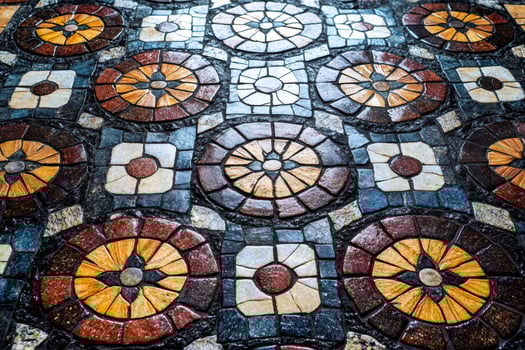 Colorful mosaic floor tiles showing intricate circular and square patterns photo