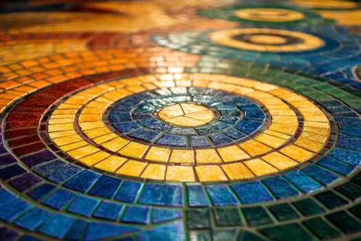 Colorful mosaic tiles creating concentric circles a decorative floor pattern photo