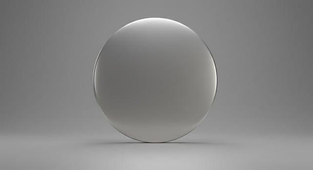 A silver oval on a gray background photo