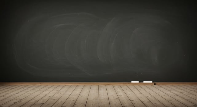 Empty room with chalkboard and wooden floor photo
