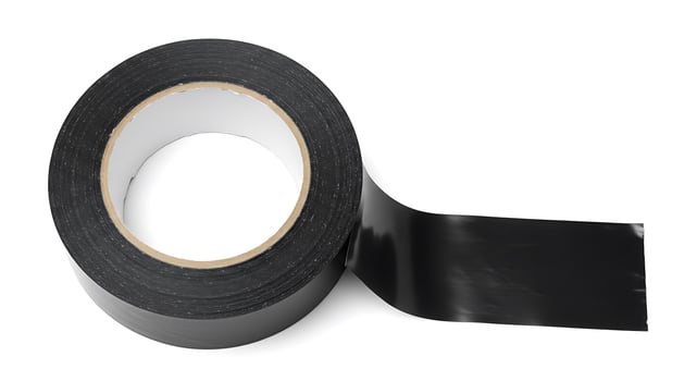 A roll of black tape on a white background photo