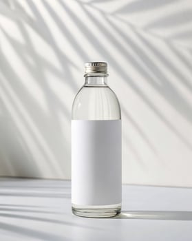 A white bottle with a white label on it photo