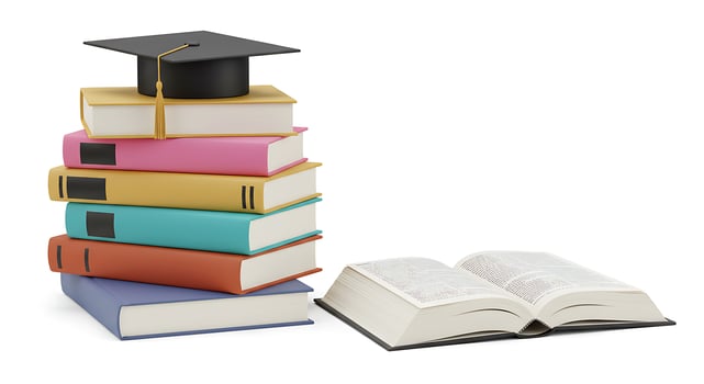 A stack of books with a graduation cap on top photo