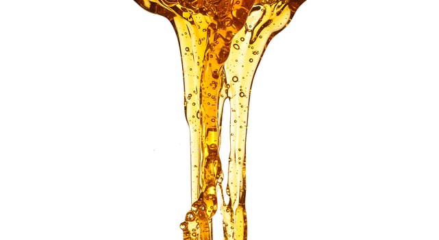 A glass of liquid being poured into a glass photo