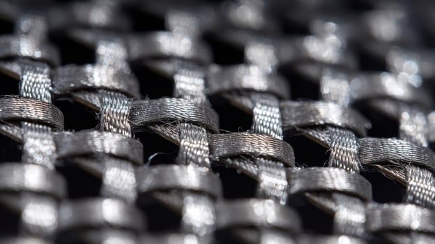 Close up view of fiber reinforced ceramic showcasing intricate weaving and exposed fibers photo