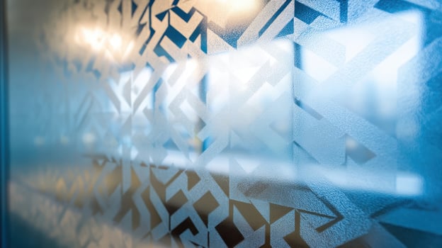 Geometric etched pattern on a glass surface creating an artistic visual experience photo