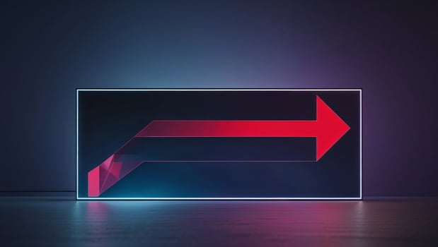 Bright red arrow on a glowing background indicating direction in a modern setting during evening hours photo