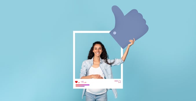 A young woman stands against a bright blue background, smiling as she holds up a large thumbs-up symbol while framed in a social media post outline, representing influencer culture. photo