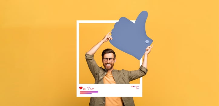 A cheerful individual holds a large thumbs up symbol within a frame, showcasing excitement about content engagement. The bright yellow background enhances the lively atmosphere. photo