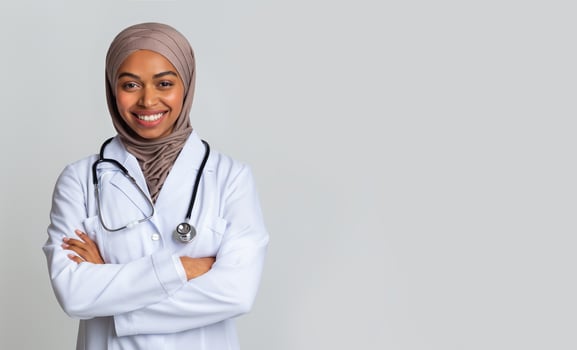 Medical Internship For Islamic People. Portrait Of Happy Black Muslim Female Doctor Student In Hijab And White Coat Over Light Background, Panorama photo