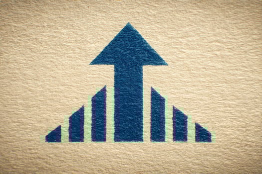 A blue upward arrow and bar graph represent growth and improvement. This visual conveys a strong message about increasing trends in business metrics and financial performance. photo