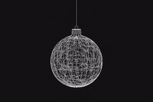 Stylish Christmas ball silhouette with intricate thin line design hanging against a dark background during the festive season photo