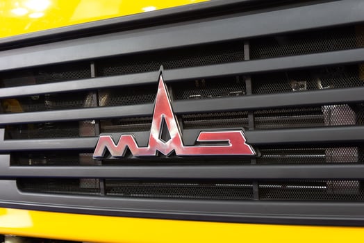 Logotype of the truck of Belarusian manufacture on the car cabin at the exhibition photo