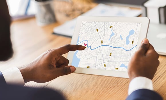 Unrecognizable Black Businessman Using Taxi Services App On Digital Tablet In Office, Looking At Virtual Map With GPS Trackers, Checking Nearest Cab, Creative Collage For Transportration Concept photo