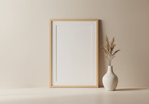 A blank frame and a vase on a beige background photo