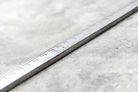 Metal ruler on concrete for accuracy photo