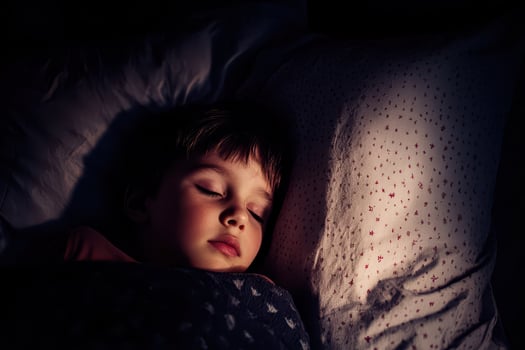 Peaceful child sleeping soundly in cozy bed photo
