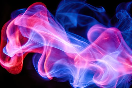 A blue and red smoke swirl on a black background photo