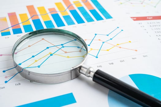 Magnifying glass spreadsheet graph paper. photo
