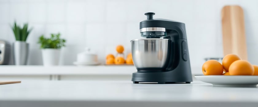 blender sitting on top of a counter next to oranges photo